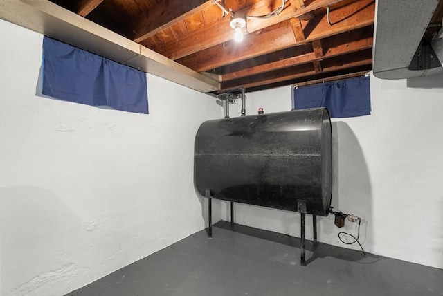 unfinished basement with oil tank