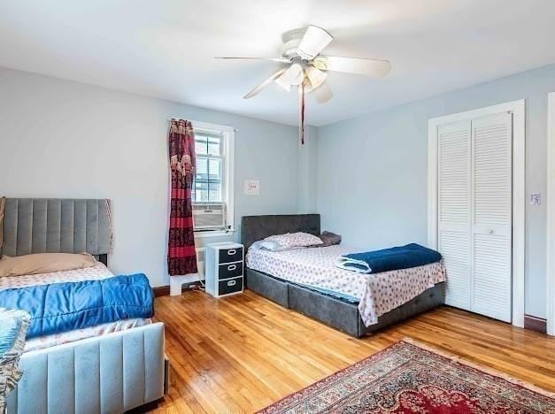 26 Beulah St, Framingham, MA 01701 - bedroom with wood finished floors, cooling unit, and a ceiling fan