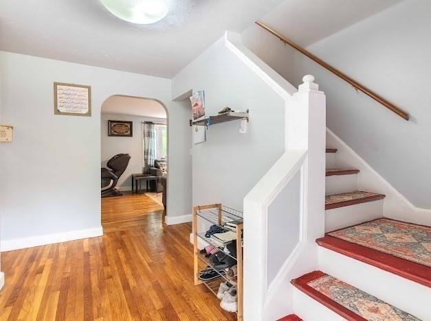 26 Beulah St, Framingham, MA 01701 - stairs with arched walkways and wood finished floors