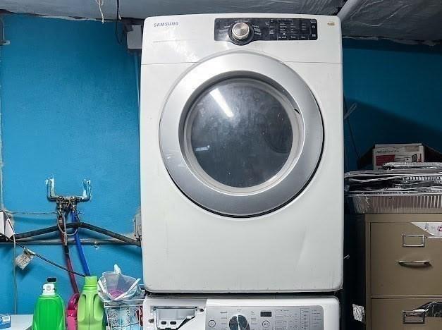 26 Beulah St, Framingham, MA 01701 - laundry area featuring stacked washer / drying machine
