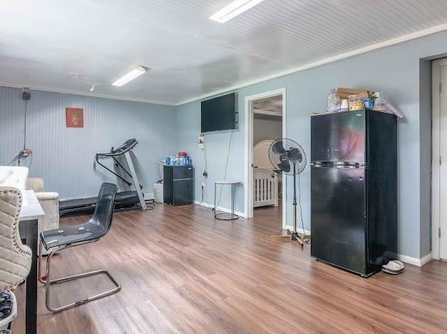 26 Beulah St, Framingham, MA 01701 - exercise area featuring wood finished floors and ornamental molding