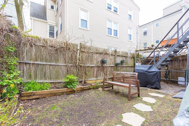 view of yard with a fenced backyard