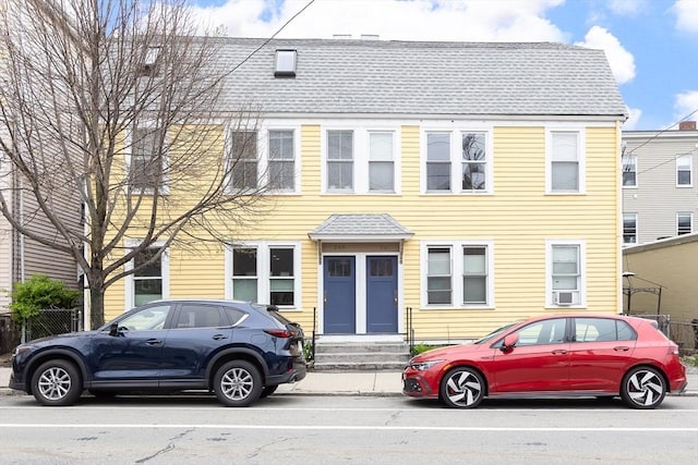 view of front of house with a shingled roof