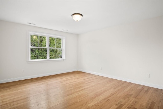 7 Locust St, Woburn, MA 01801 - unfurnished room featuring light wood finished floors and baseboards