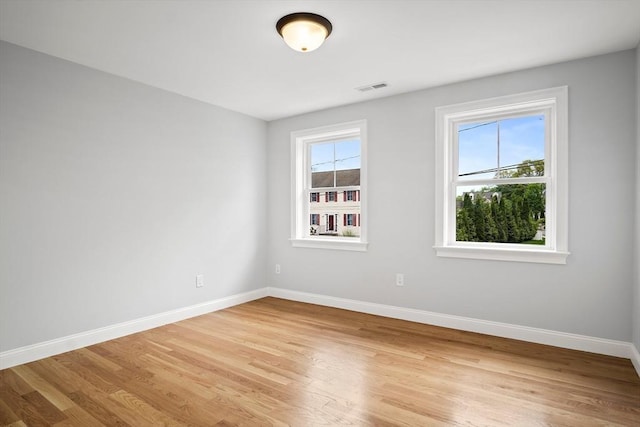 7 Locust St, Woburn, MA 01801 - empty room with baseboards and light wood finished floors