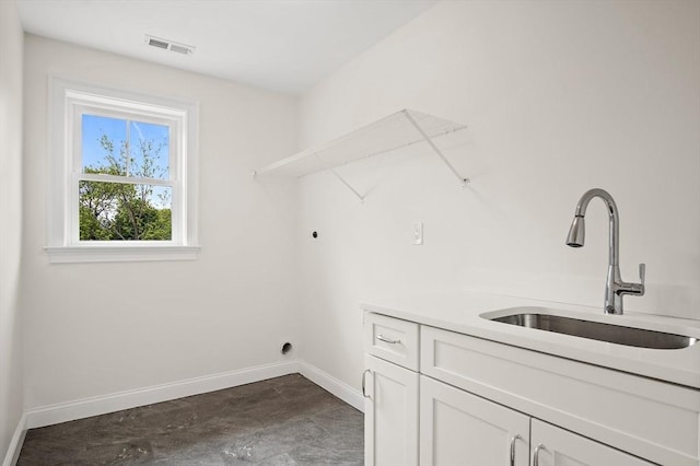 7 Locust St, Woburn, MA 01801 - laundry room with cabinet space, hookup for an electric dryer, and baseboards