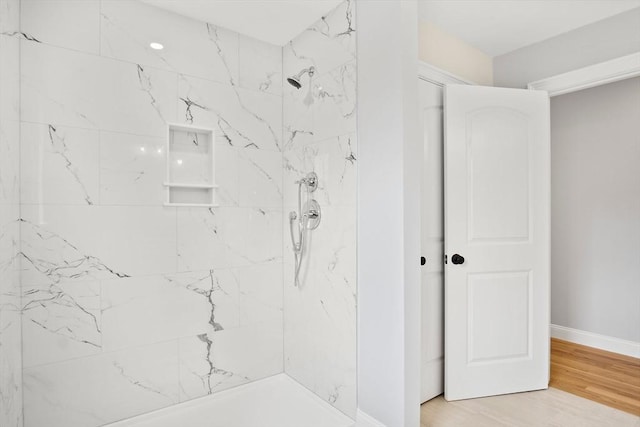 7 Locust St, Woburn, MA 01801 - full bath featuring tiled shower, baseboards, and wood finished floors