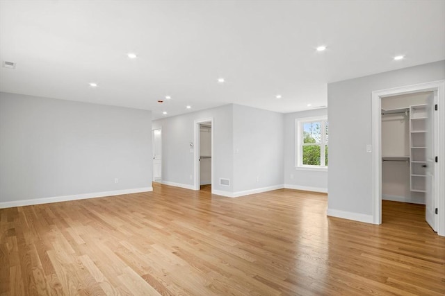 7 Locust St, Woburn, MA 01801 - unfurnished living room with light wood-type flooring, baseboards, and recessed lighting