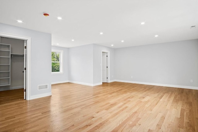 7 Locust St, Woburn, MA 01801 - spare room featuring light wood-style floors, recessed lighting, and baseboards