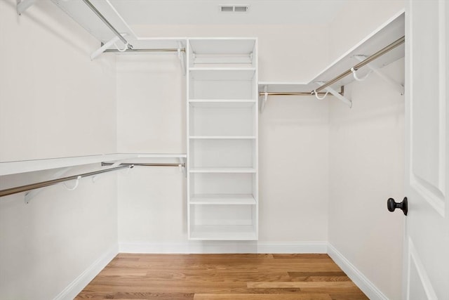 7 Locust St, Woburn, MA 01801 - walk in closet with light wood-style floors