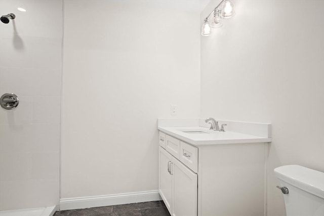 7 Locust St, Woburn, MA 01801 - full bath with a tile shower, toilet, vanity, and baseboards
