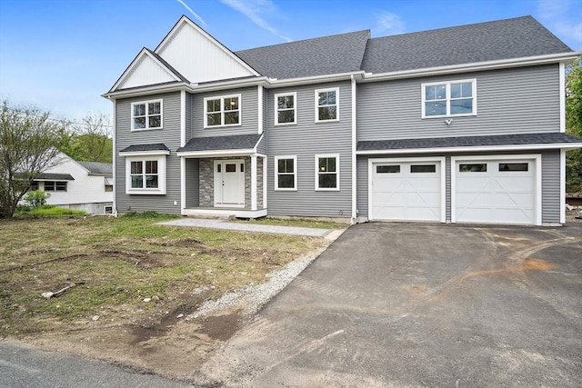 7 Locust St, Woburn, MA 01801 - view of front facade featuring asphalt driveway, an attached garage, and a shingled roof