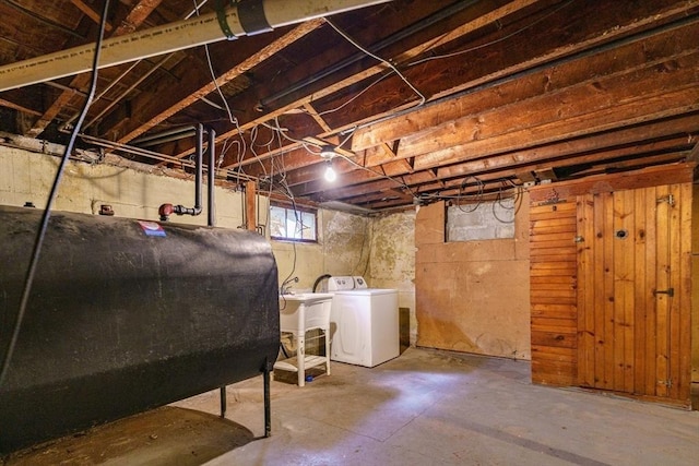 basement with wooden walls and sink