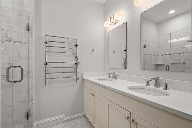 bathroom with radiator, an enclosed shower, and vanity