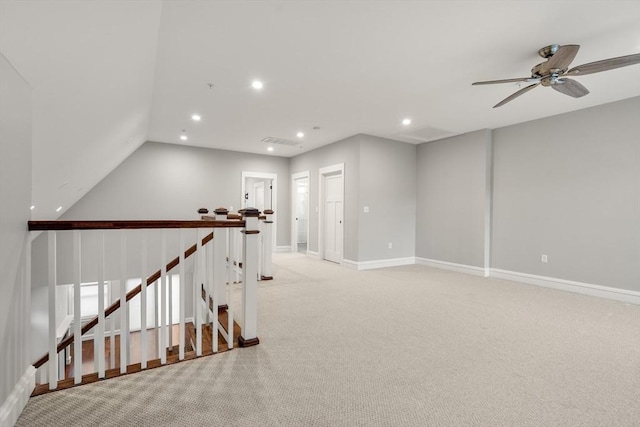 unfurnished room with ceiling fan and light colored carpet