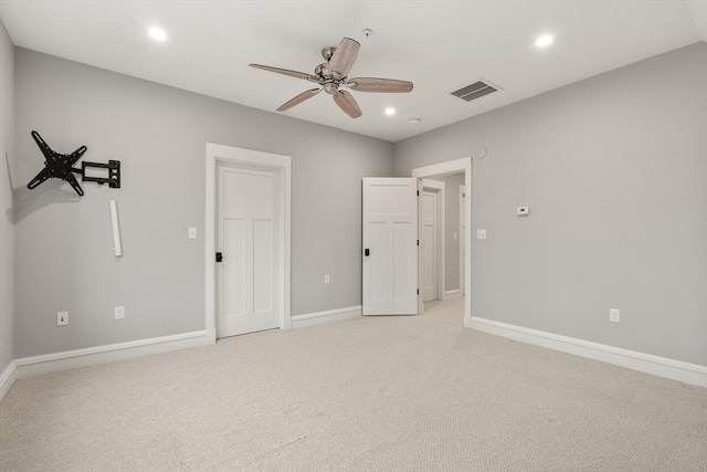 unfurnished bedroom featuring ceiling fan and light carpet