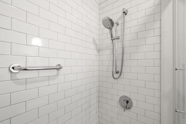 bathroom with tiled shower