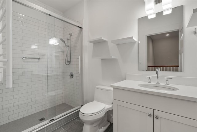 bathroom with vanity, an enclosed shower, tile patterned floors, and toilet