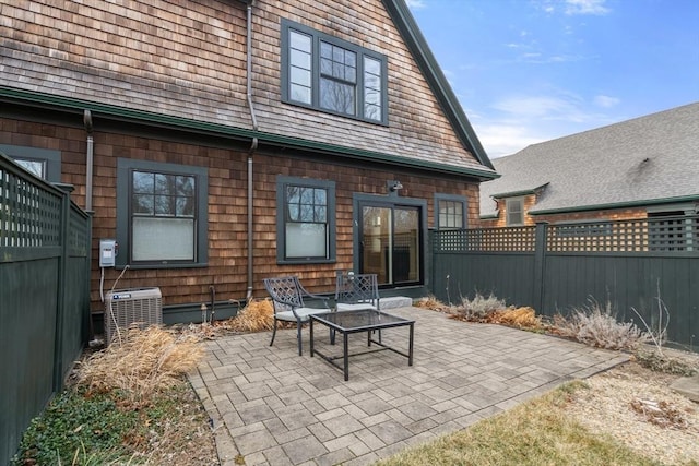 back of house featuring central AC and a patio