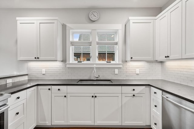 kitchen featuring white cabinets and sink