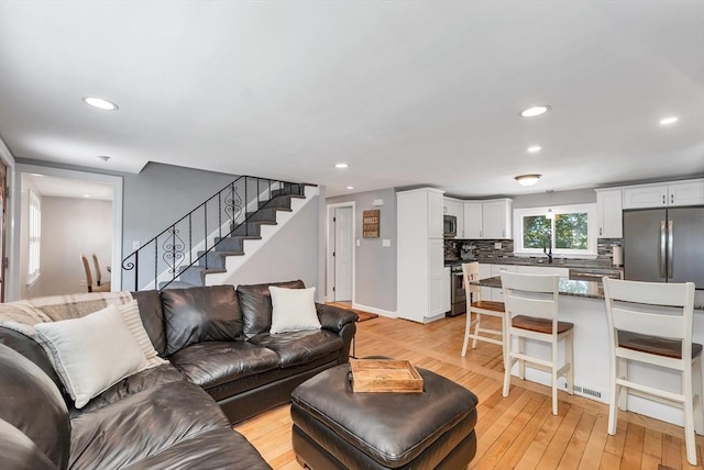 49 Pinehurst Ave, Methuen, MA 01844 - living room featuring stairs, recessed lighting, and light wood-style flooring