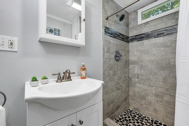 49 Pinehurst Ave, Methuen, MA 01844 - bathroom featuring tiled shower, vanity, and ornamental molding