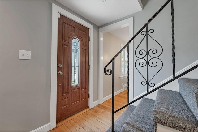 49 Pinehurst Ave, Methuen, MA 01844 - foyer with light wood-style floors, stairway, baseboards, and plenty of natural light