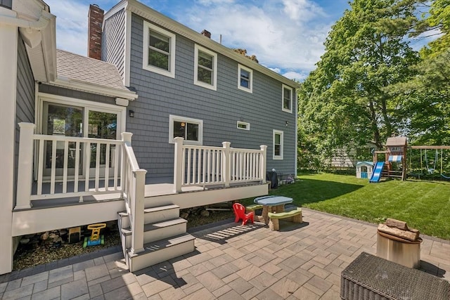 49 Pinehurst Ave, Methuen, MA 01844 - rear view of property with a chimney, a yard, a patio, a playground, and a wooden deck