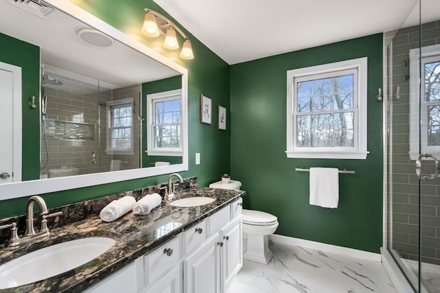 bathroom featuring visible vents, marble finish floor, baseboards, and a sink