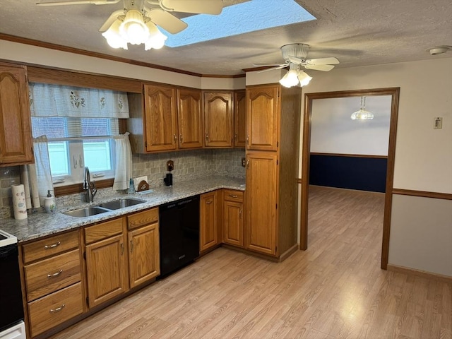 kitchen featuring backsplash, dishwasher, light wood-type flooring, and sink