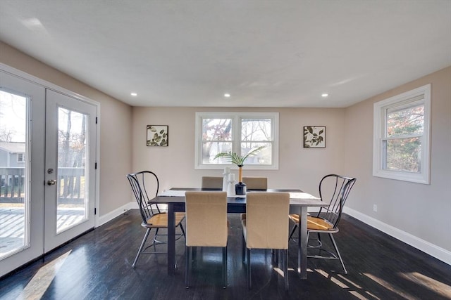 dining space with french doors and dark hardwood / wood-style flooring