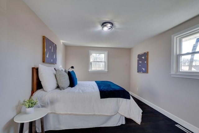 bedroom featuring dark wood-type flooring