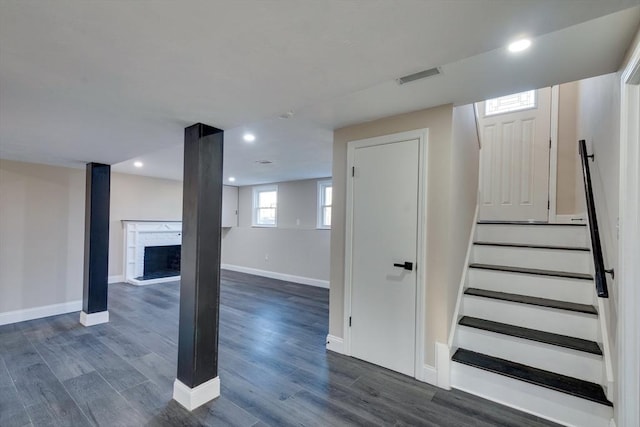 stairs featuring wood-type flooring