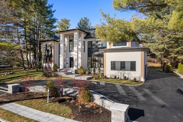 contemporary home featuring stucco siding