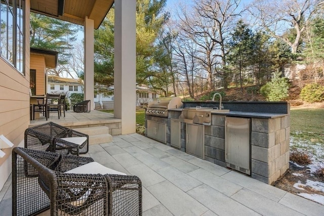 view of patio / terrace featuring exterior kitchen and area for grilling