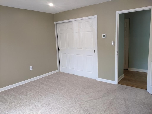 77 Adams St Unit 109, Quincy, MA 02169 - unfurnished bedroom with carpet floors, a closet, and baseboards