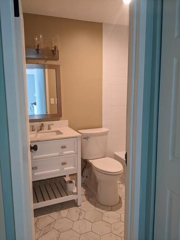 77 Adams St Unit 109, Quincy, MA 02169 - bathroom featuring vanity, toilet, and tile patterned floors