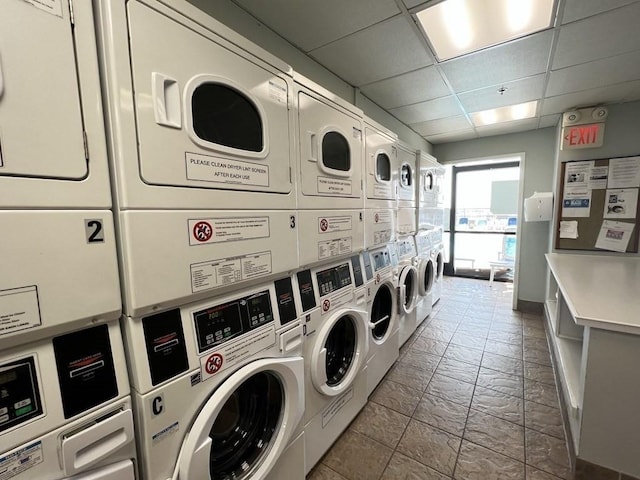 77 Adams St Unit 109, Quincy, MA 02169 - communal laundry room featuring stacked washer / drying machine, washer and clothes dryer, and stone tile floors
