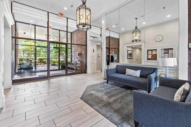 77 Adams St Unit 109, Quincy, MA 02169 - common area with a towering ceiling, floor to ceiling windows, and recessed lighting