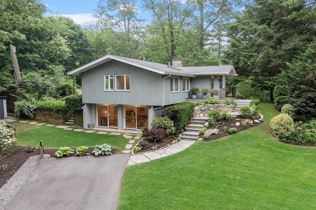 5 Mason St, Lexington, MA 02421 - view of front of house with stairs, a chimney, and a front lawn