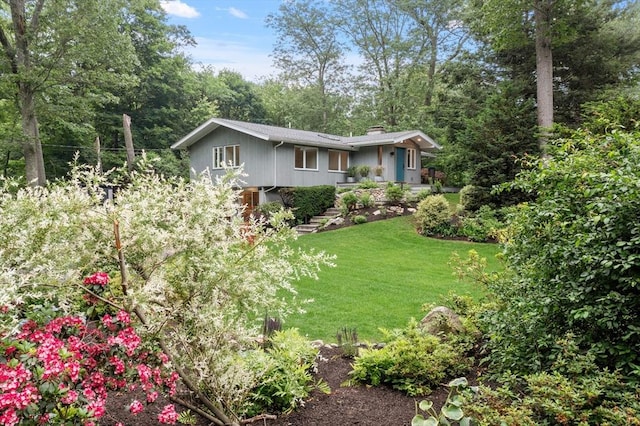 5 Mason St, Lexington, MA 02421 - view of front of home with a chimney and a front yard
