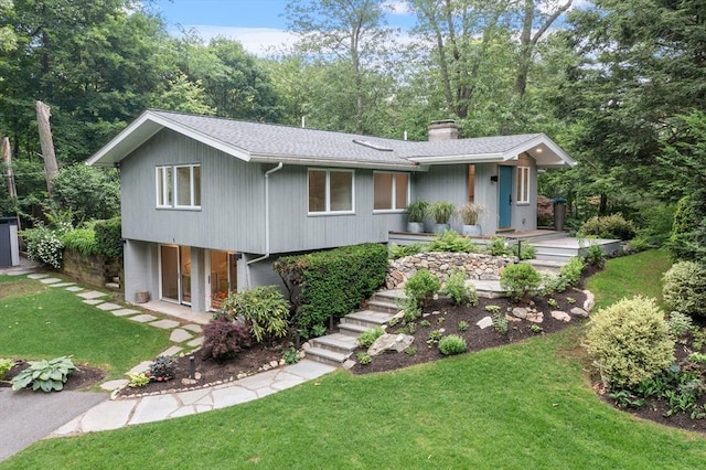 5 Mason St, Lexington, MA 02421 - view of front of property with a chimney, a front lawn, and a shingled roof