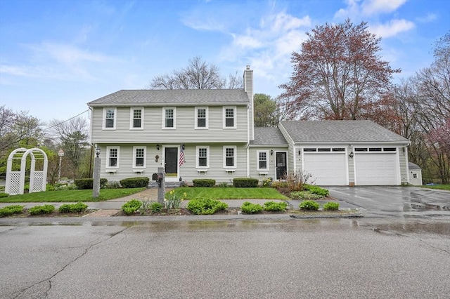 1 Island Rd, Medway, MA 02053 - colonial-style house featuring a chimney, an attached garage, and asphalt driveway