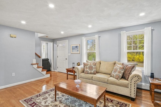 1 Island Rd, Medway, MA 02053 - living area with plenty of natural light, recessed lighting, stairway, light wood-style flooring, and baseboards