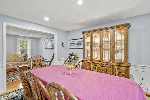1 Island Rd, Medway, MA 02053 - dining room with wood finished floors, a decorative wall, wainscoting, and recessed lighting