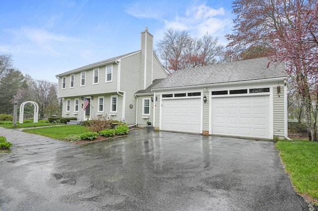 1 Island Rd, Medway, MA 02053 - colonial inspired home with asphalt driveway, an attached garage, a chimney, and a front yard