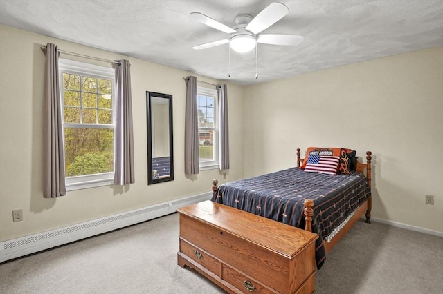 1 Island Rd, Medway, MA 02053 - carpeted bedroom featuring a baseboard heating unit, baseboards, and a ceiling fan