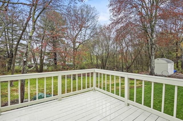1 Island Rd, Medway, MA 02053 - wooden deck with a storage shed, a lawn, and an outbuilding