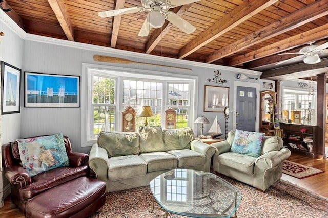 living room with wooden ceiling, ornate columns, and beamed ceiling