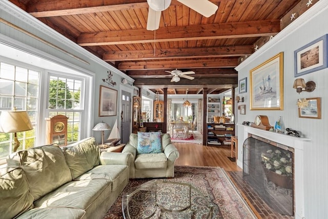 living room featuring wooden ceiling, hardwood / wood-style floors, and beamed ceiling